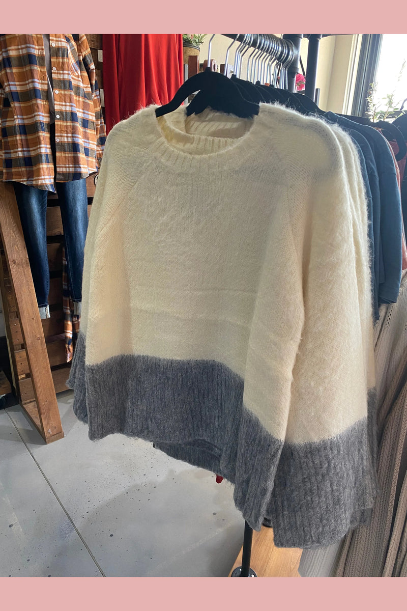 Dual tone grey and white fuzzy sweater.