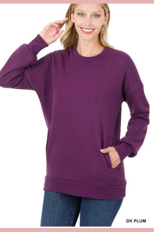 round neck sweatshirt in plum with pockets. 