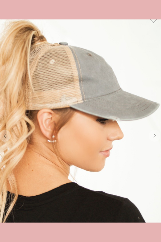 Distressed pony tail cap with velcro closure. 
