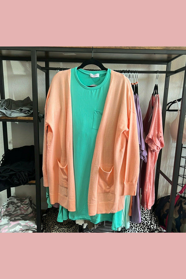 soft salmon colored cardigan with pockets