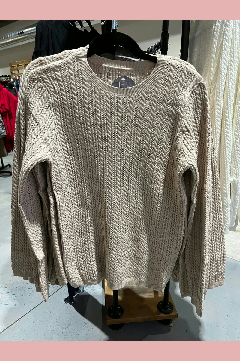 Khaki colored lightweight transition sweater. 