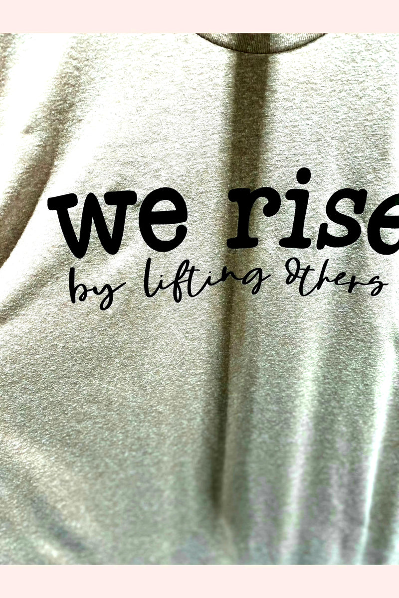 We rise by lifting others graphic tee. 